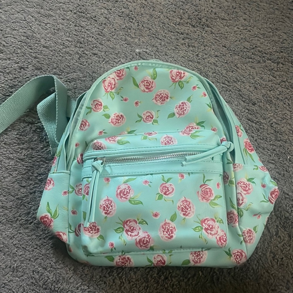 a teal floral print small backpack